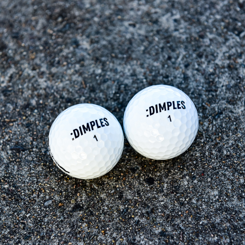 Double Dimples Pro Just White Golf Ball Showing Logo And Ball Number