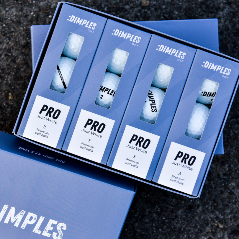 A dozen of the Dimples Pro Just White Golf Balls